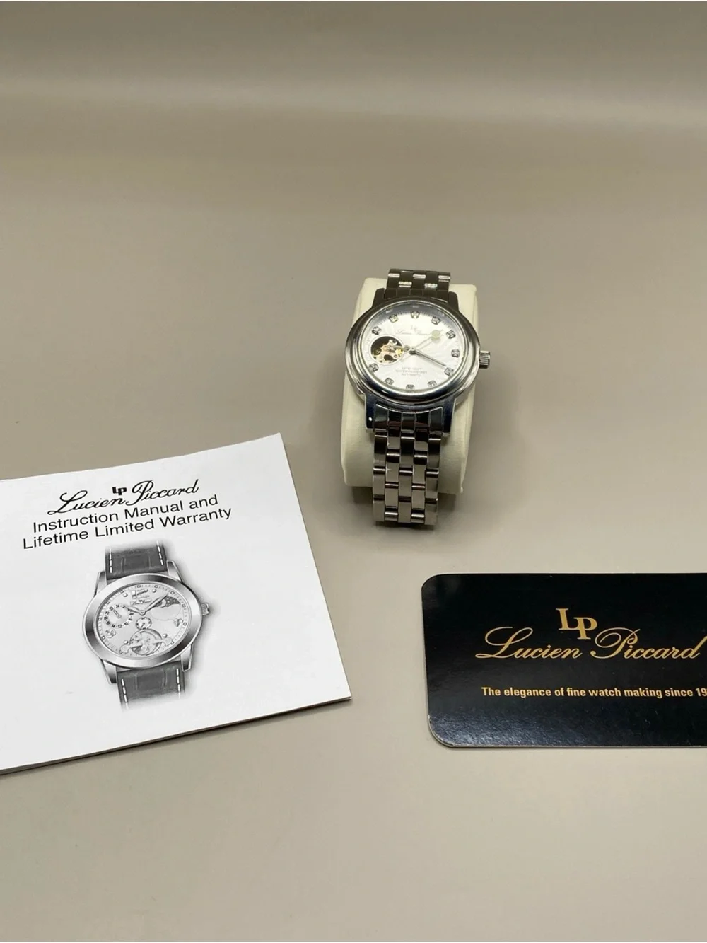 Lucien Piccard automatic stainless steel with diamond stone very good condition